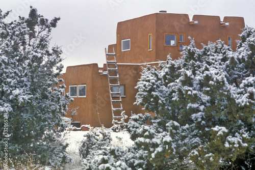 Adobe in snow in Santa Fe, NM