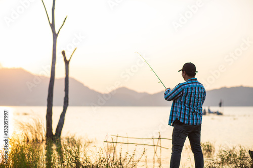 Office man self quarantine in with the nature by fishing in the lake. Quarantine concept