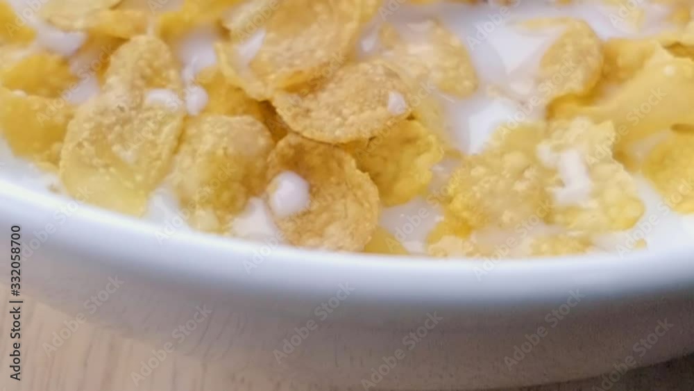 Slider Shot of Milk on Cereal in a Bowl Slider Shot of Milk on Cereal in a Bowl