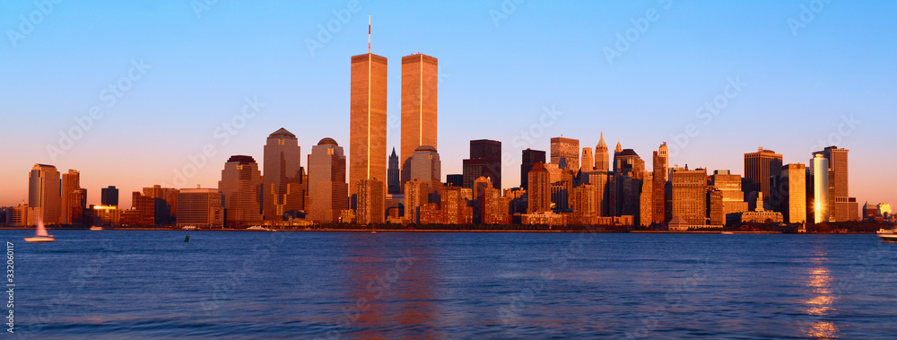 Panoramic view of lower Manhattan and Hudson River, New York City skyline, NY with World Trade Towers at sunset