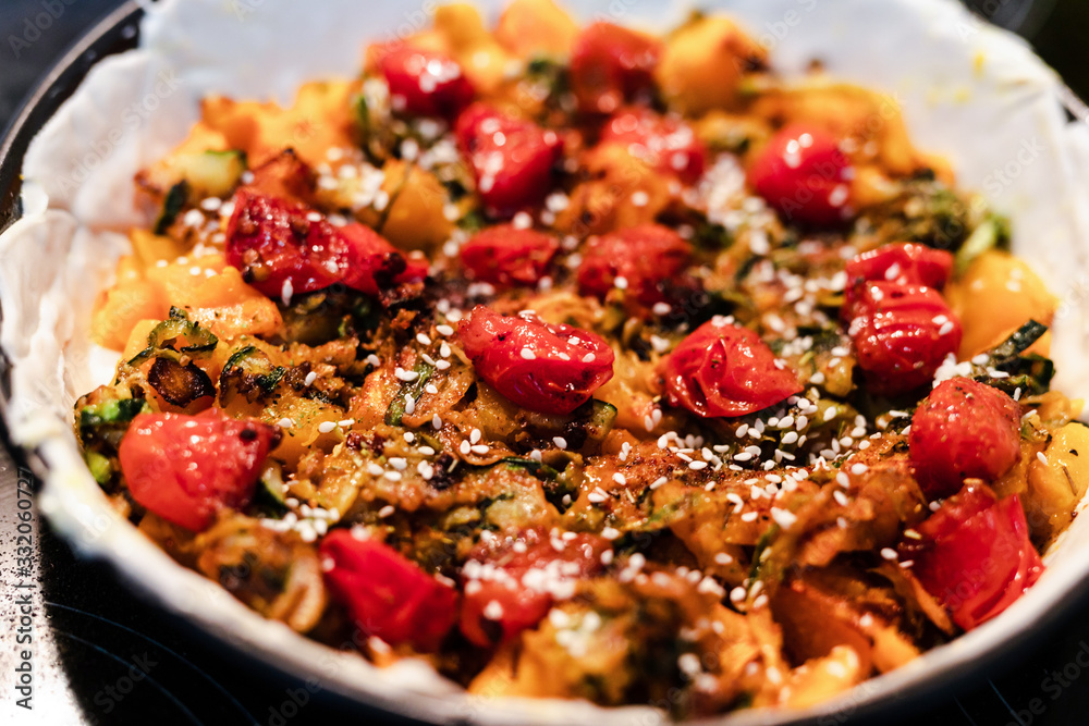 plant-based food recipes, vegan pie with pumpkin zucchini and roasted cherry tomatoes getting prepared plant-based food recipes, vegan pie with pumpkin zucchini and roasted cherry tomatoes getting prepared