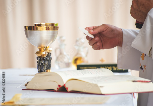 Mass is the central act of worship of the Roman Catholic Church, which culminates in celebration of the sacrament of the Eucharist photo