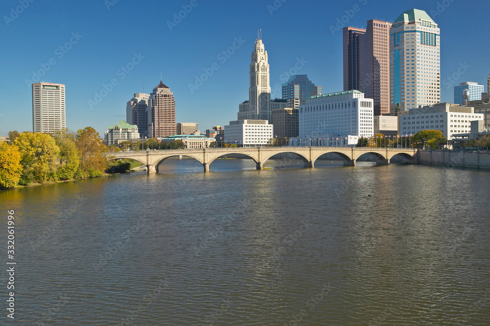 Scioto River and Columbus Ohio skyline in autumn, with setting sunlight