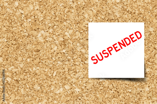 White note with word suspended on cork board background  with copy space (Vector)