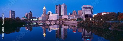 Scioto River and Columbus Ohio skyline, the capital city, at dusk with lights on