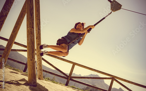 Adult woman having fun on zipline photo