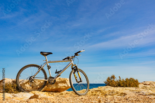 Fototapeta Naklejka Na Ścianę i Meble -  Bicycle on beach, active lifestyle.
