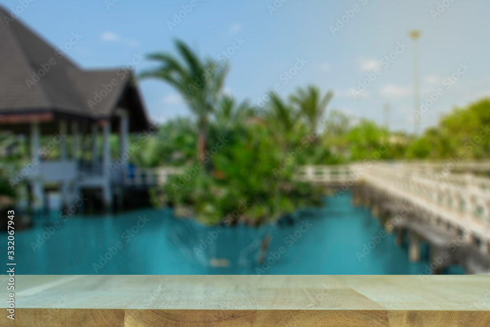 display products on the table, background, beside the pool and water pavilion