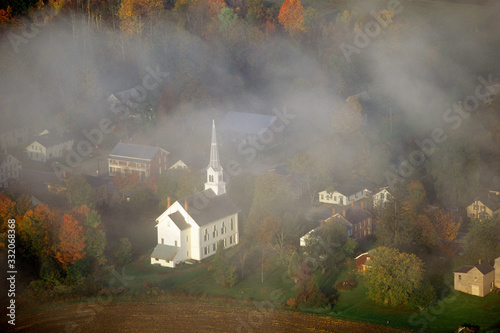 Aerial view of Stowe, VT in Autumn on Scenic Route 100, through fog