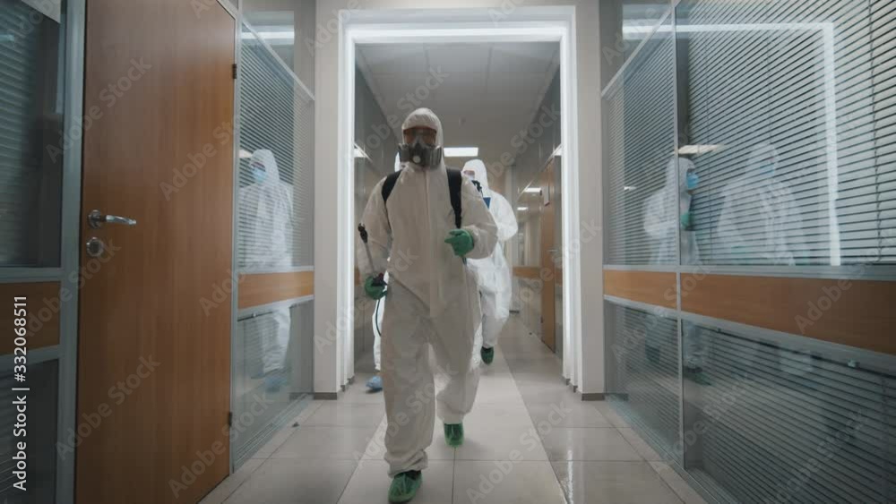 Specialists disinfecting empty office during quarantine of coronavirus Specialists disinfecting empty office during quarantine of coronavirus
