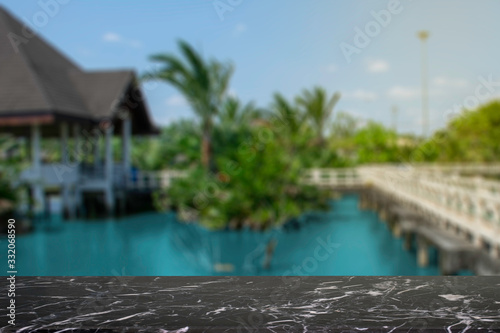 display products on the table  background  beside the pool and water pavilion