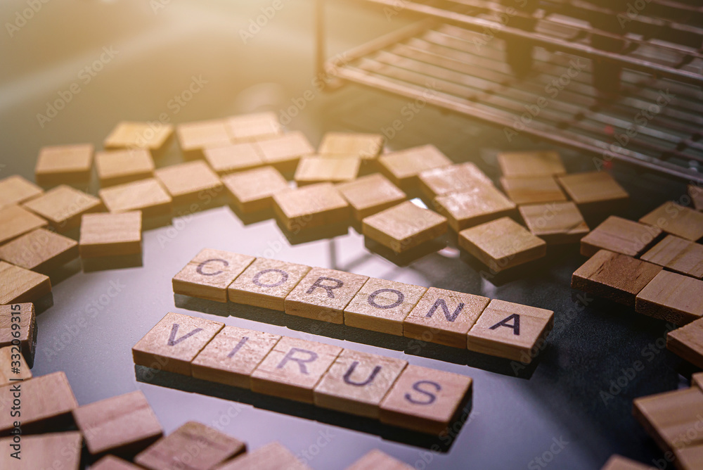 Corona virus wooden text on the black table Corona virus wooden text on the black table