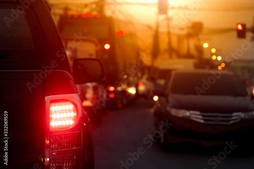 Blurred image of cars on the road with light break at in evening. © thongchainak
