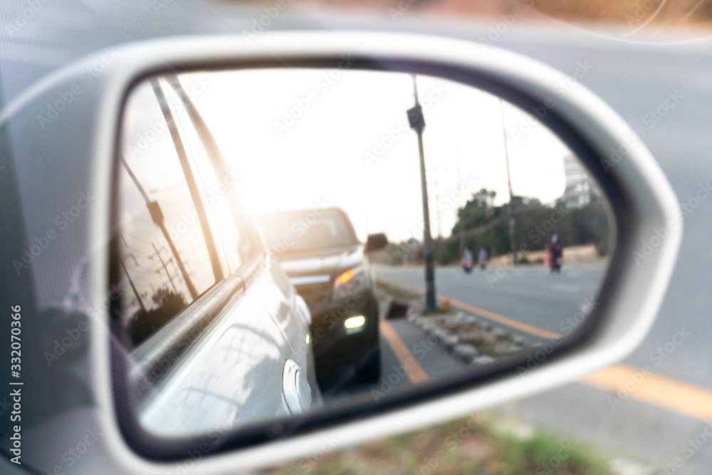 Side view of car mirror traffic of rear-end vehicles on the road. Side view of car mirror traffic of rear-end vehicles on the road.