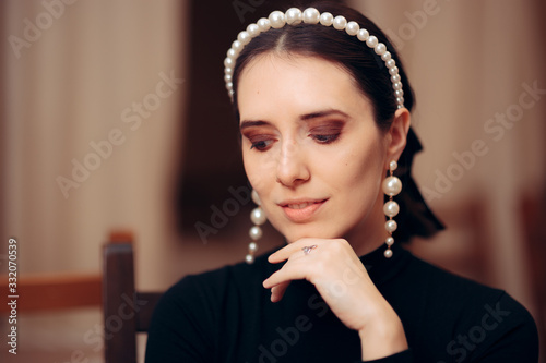 Fototapeta Portrait of an Elegant Woman Wearing Pearl Accessories