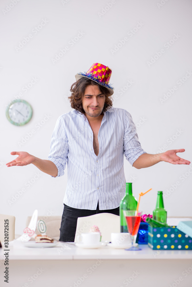 Young man celebrating his birthday at home Young man celebrating his birthday at home