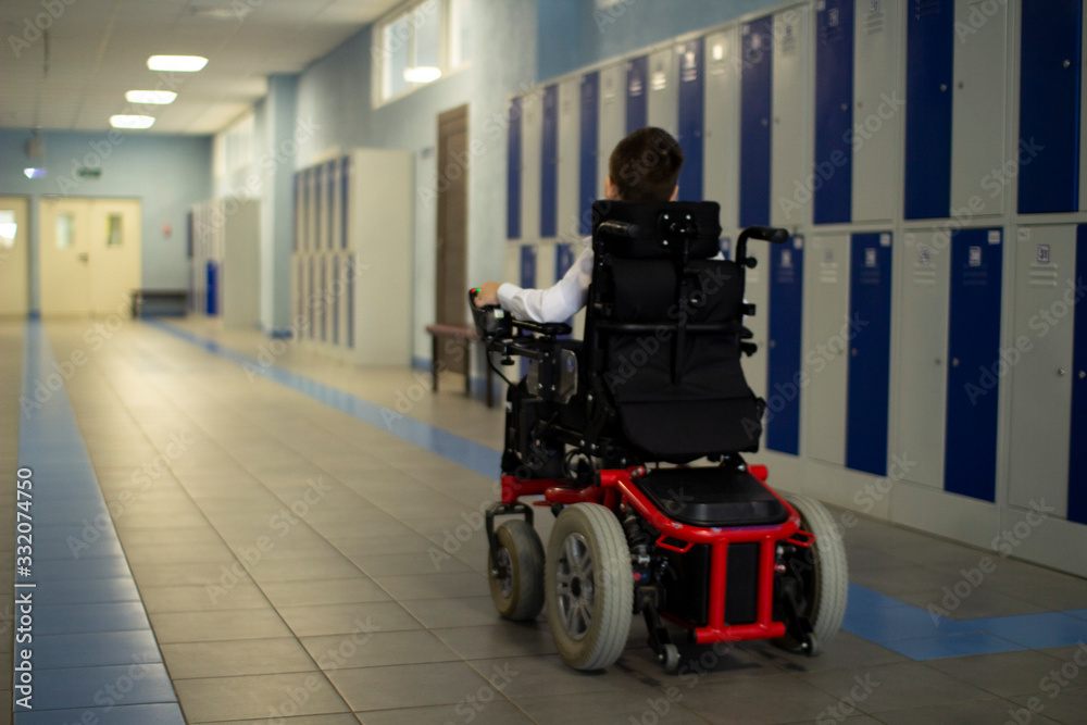 A disabled student in a wheelchair in primary school.