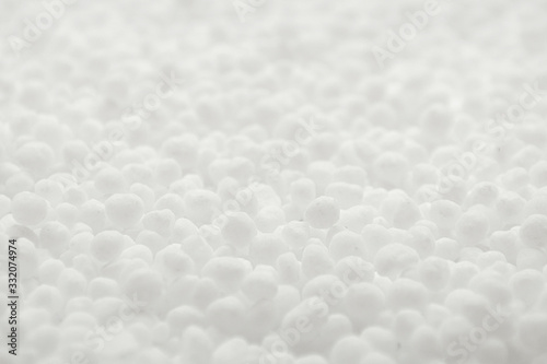 Fototapeta Naklejka Na Ścianę i Meble -  White round urea fertilizer closeup. Chemical fertilizer carbamide. Mineral fertilizers are white balls of carbamide (urea). Background, texture.