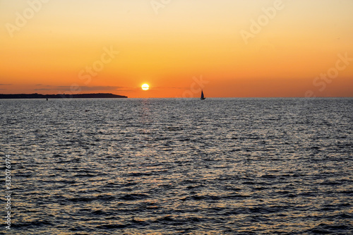 Sailing boats on a background of a beautiful sunset