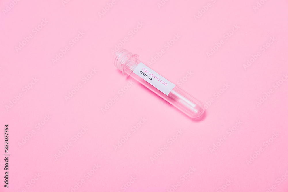 Minimal pop art style. COVID-19 test and open and empty laboratory sample for diagnosis new Coronavirus infection on pink background. Flat lay. Minimal pop art style. COVID-19 test and open and empty laboratory sample for diagnosis new Coronavirus infection on pink background. Flat lay.
