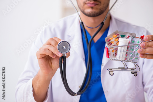 Young male doctor cardiologist working in the clinic