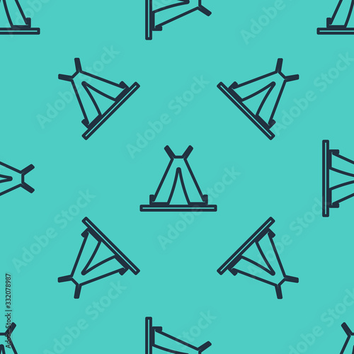 Black line Traditional indian teepee or wigwam icon isolated seamless pattern on green background. Indian tent.  Vector Illustration