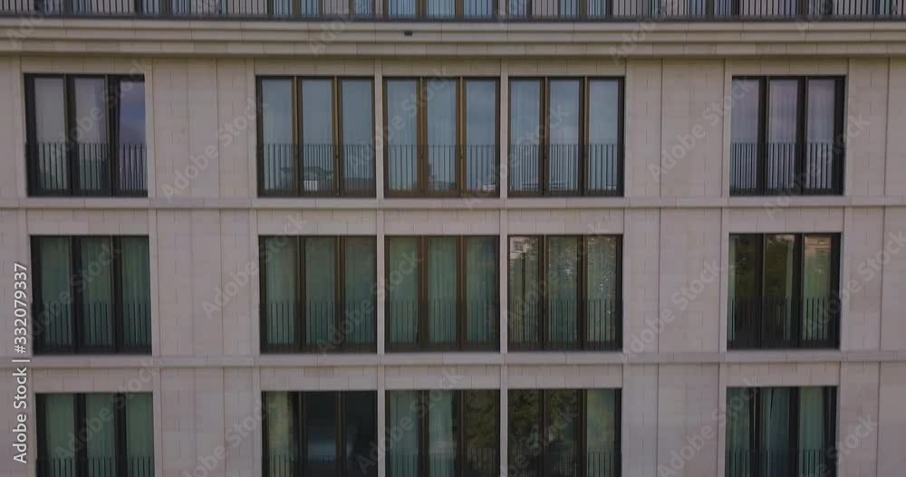 Drone shot flying above near hotel windows Drone shot flying above near hotel windows