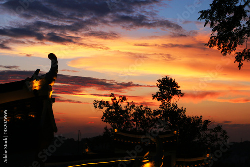 A corner of the temple building at sunset photo