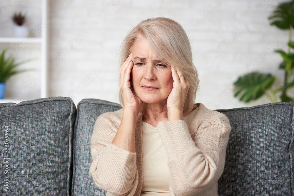 Sad senior woman having headache. Old lady is sick Sad senior woman having headache. Old lady is sick
