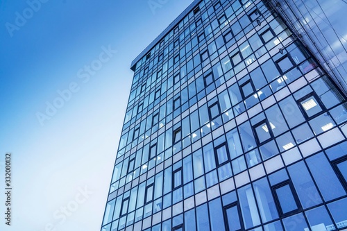 glass building against the sky. Modern urban design