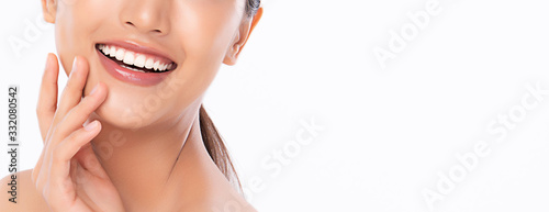 Obraz na plátně Beautiful smile young woman. White teeth on white background,