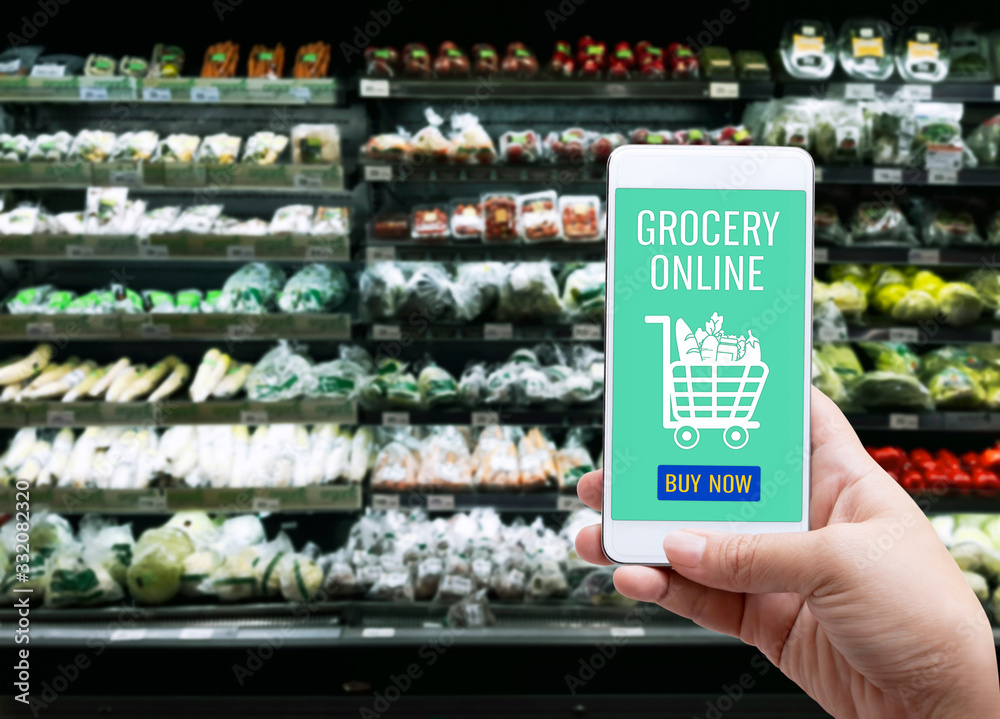 Online order grocery shopping on touch screen concept. Woman hand holding smart phone for ordering food delivery ingredients service at home for cooking. Business and technology for lifestyle in city. Online order grocery shopping on touch screen concept. Woman hand holding smart phone for ordering food delivery ingredients service at home for cooking. Business and technology for lifestyle in city.
