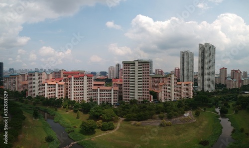 high panoramic view of a residential area surrounded by the neighborhood park © Cons