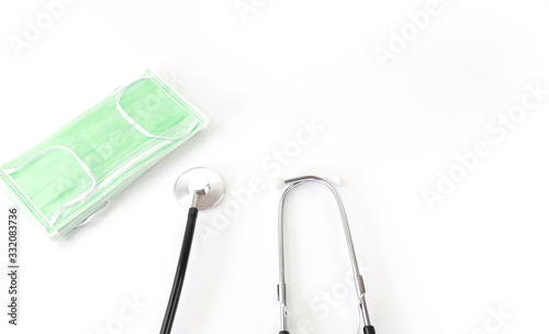  Surgical mask protective mask with CORONAVIRUS and  stethoscope on white background,healthy  of Covid 19 virus concept