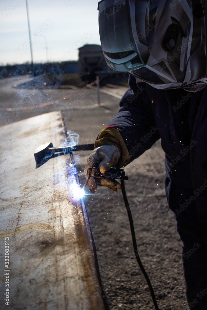 Fototapeta premium Welding Master on the Production Line. welder