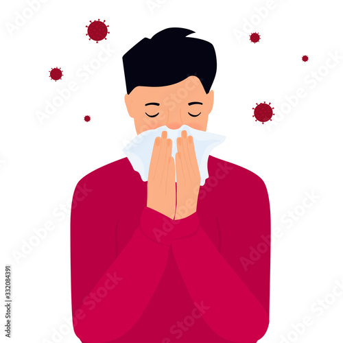 COVID-19. Coronavirus symptoms. The boy is coughing behind a napkin. Runny nose
