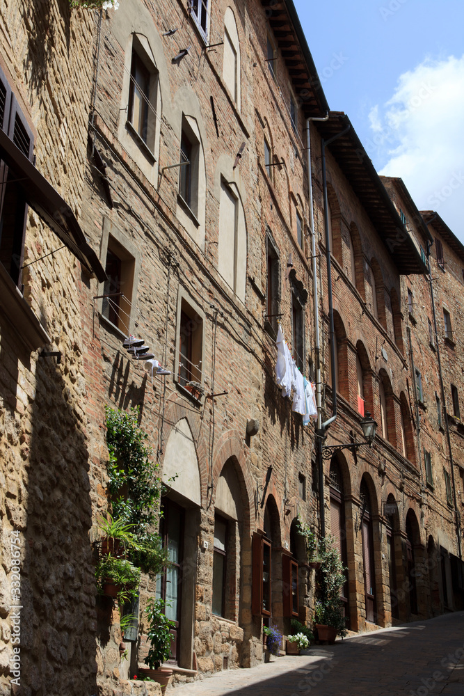 Volterra (SI), Italy - April 25, 2017: Typical houses in centre of Volterra, Tuscany, Italy