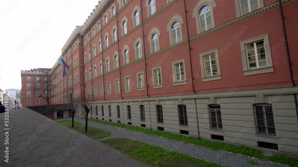 Side facade of building with flags raised. Static Side facade of building with flags raised. Static
