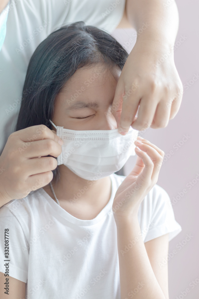 Asian little girl wear a protective medical mask Asian little girl wear a protective medical mask