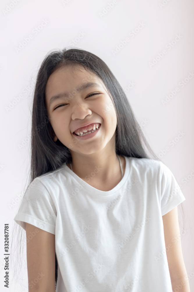 Asian little girl laughs with happiness. Asian little girl laughs with happiness.