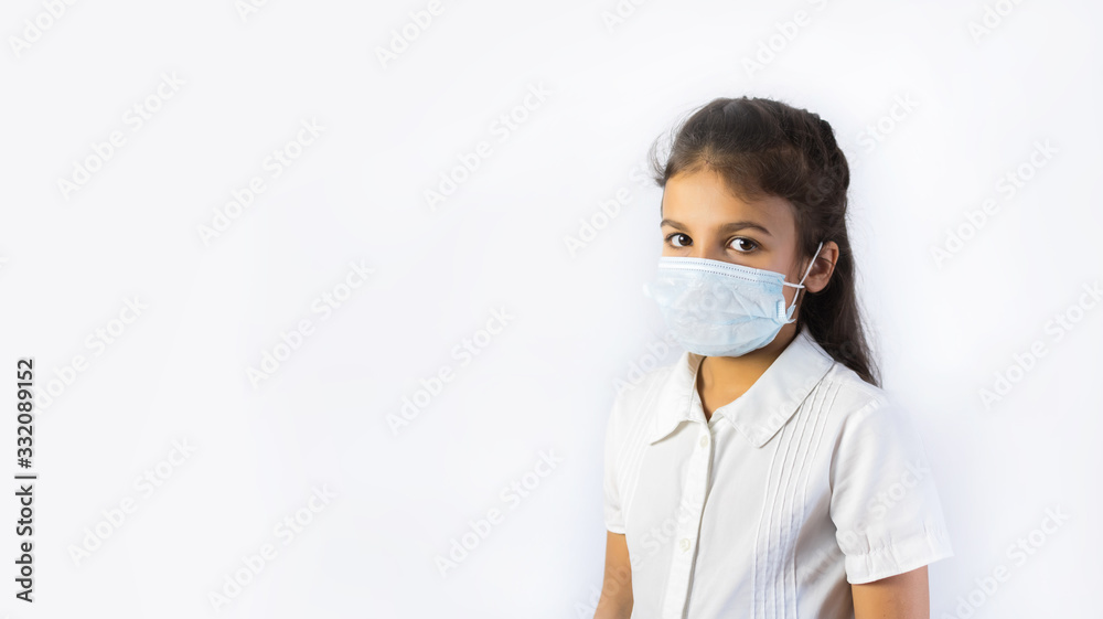Coronavirus and Air pollution concept. Little indian or pakistani girl wearing mask for protect pm2.5. Isolated on white background. Coronavirus and Air pollution concept. Little indian or pakistani girl wearing mask for protect pm2.5. Isolated on white background.