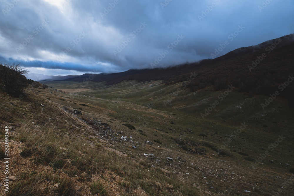 A valley next to Campo Imperatore in a cloudy day, Italy A valley next to Campo Imperatore in a cloudy day, Italy
