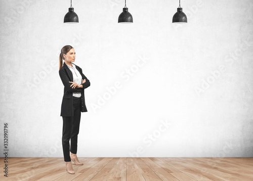 Confident businesswoman in empty room