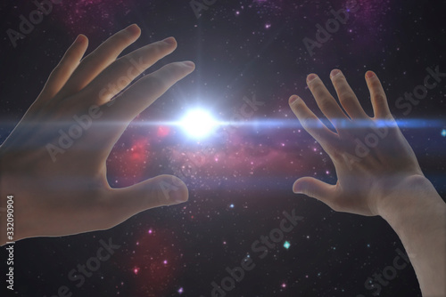 a human hand cover the light stroke frome the night star sky. elements of this image furnished by nasa