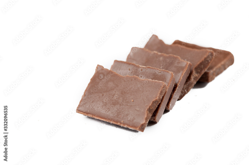 Chocolate cubes isolated on white background.Copy space Chocolate cubes isolated on white background.Copy space