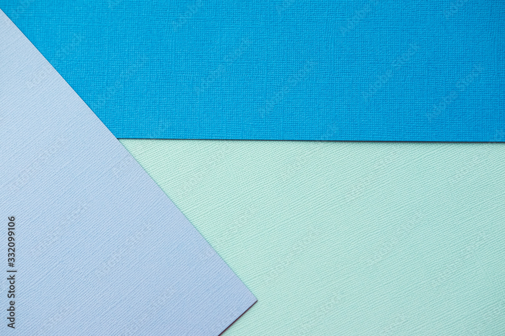 Mixing blue and turquoise design paper. The view from the top.