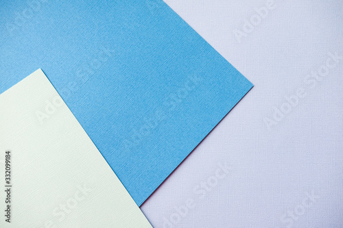 Mixing blue and turquoise design paper. The view from the top.