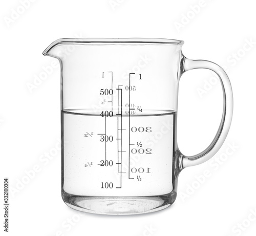 Tableau sur toile Measuring cup with clear water isolated on white