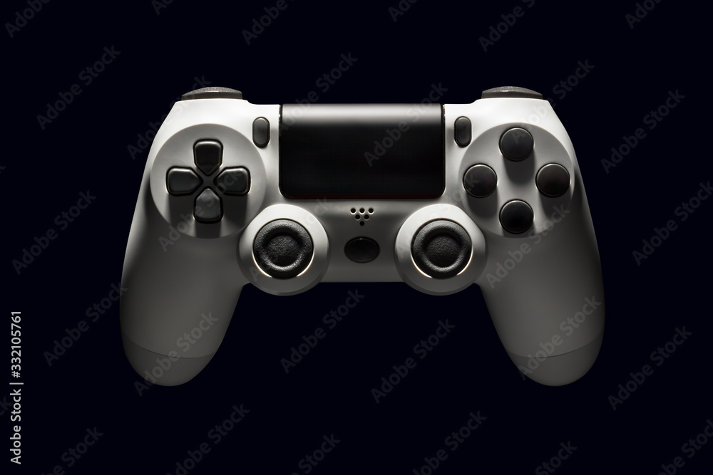 White video game joystick gamepad isolated on a black background White video game joystick gamepad isolated on a black background