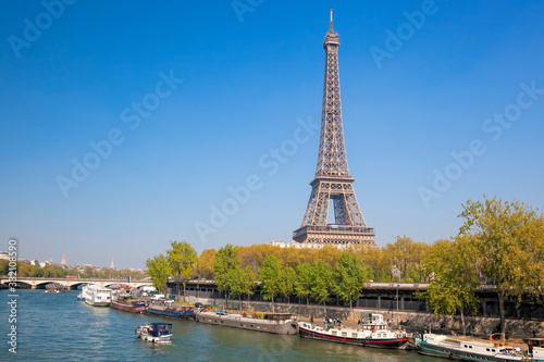 Paris with Eiffel Tower against boats during spring time in France © Tomas Marek